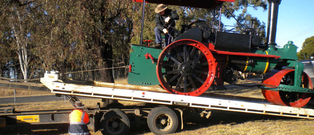 Council staff load the steam roller from Yangan Rd depot to transport it to Steam Railway precinct for restorations by community members. Council staff load the steam roller from Yangan Rd depot to transport it to Steam Railway precinct for restorations by community members.